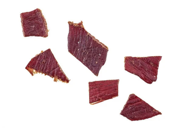 Carne seca sobre un fondo blanco blanco, vista superior . —  Fotos de Stock