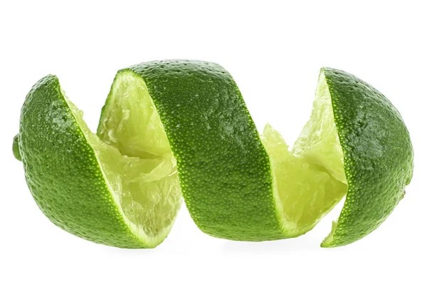 Cut lime in shape of a spiral on white background — Stock Photo, Image