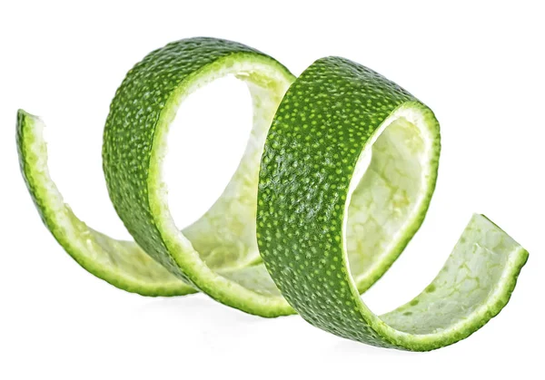 Peel of fresh lime over white background, closeup. — Stock Photo, Image