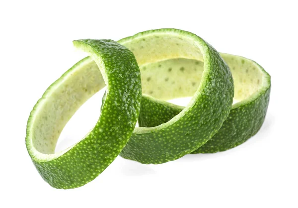 Peel of fresh ripe lime on a white background. Curly lime twist. — Stock Photo, Image