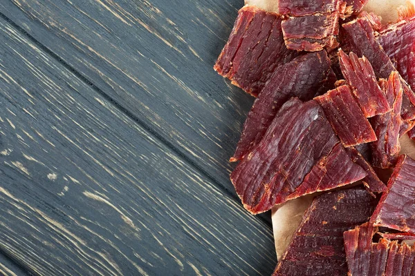 Spicy Beef Jerky Wooden Background Top View — Stock Photo, Image