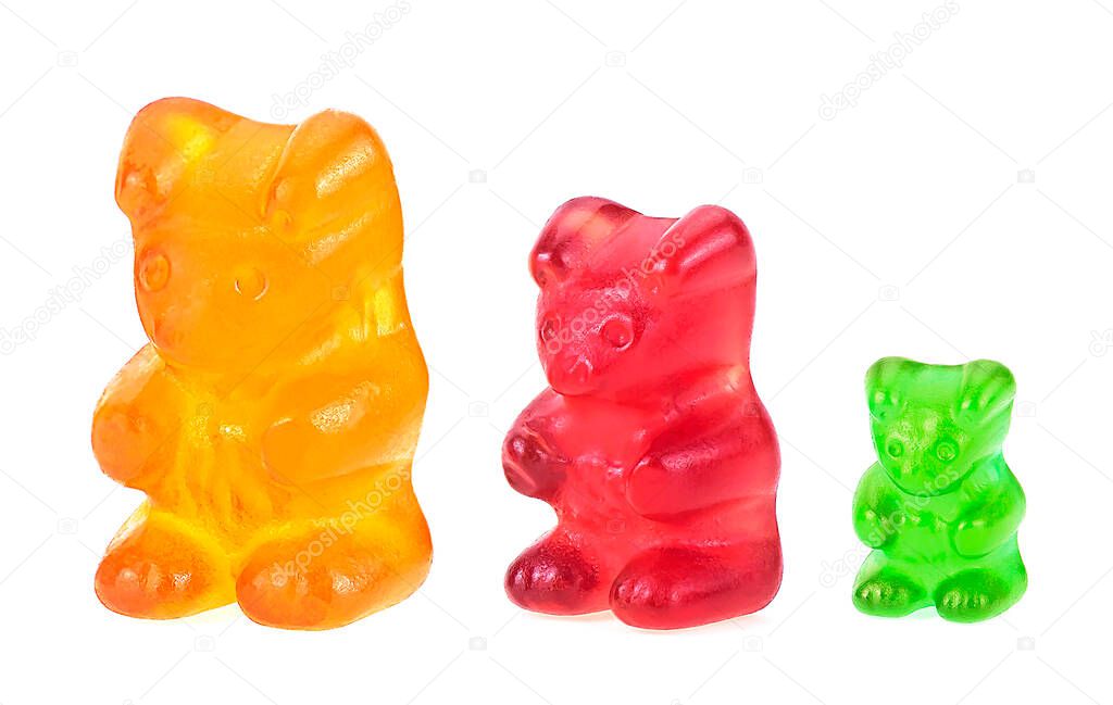 Different sizes and color of jelly gummy bears isolated on a white background. Jelly candies. Childhood.