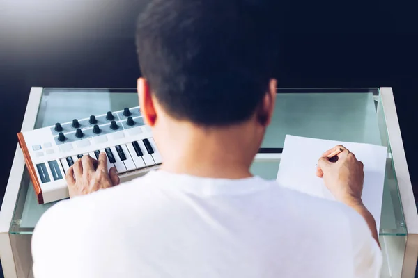Back Asian Male Songwriter Playing Music Keyboard Writing Song Blank — Stock Photo, Image