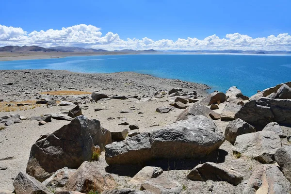 China. Great lakes of Tibet. Big stones of the store of the lake Teri Tashi Namtso in june