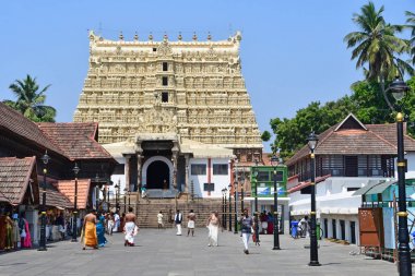 Trivandrum (Tiruvanantapura), state Kerala, India, March, 12, 2019. People walking near Shri Padmanabhaswamy temple, Trivandrum, Kerala, India clipart