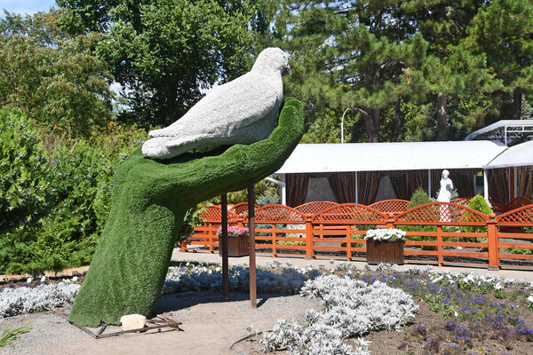 Anapa, Russia, July, 16, 2018. Park sculpture "the Dove in the palm" in Anapa