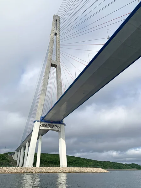 Russia, Vladivostok. Bridge to Russkiy island in cloudy summer day