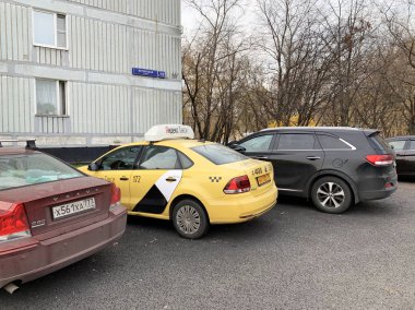 Moscow, Russia, October, 16, 2019. Parking Yandex taxi in the yard of residential house 12 on Ketcherskaya   street 