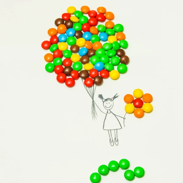 Ingravidez. Chica con bolas de colores de dulces. Levántate. S Imagen De Stock
