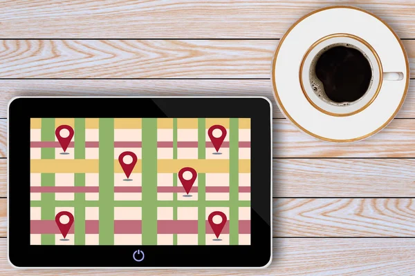 tablet bilgisayar ve kahve fincanı