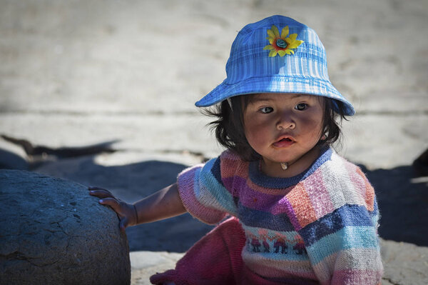 TARABUCO, BOLIVIA  AUGUST 06, 2017: Unidentified young indigenous native Quechua children at the local Tarabuco Sunday Market, Bolivia -South America