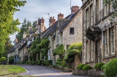 Quaint Cotswold romantic stone cottages on The Hill,  in the lovely Burford village, Cotswolds, Oxfordshire, England  clipart