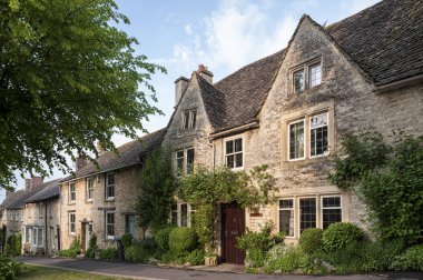 Quaint Cotswold romantic stone cottages on The Hill,  in the lovely Burford village, Cotswolds, Oxfordshire, England  clipart