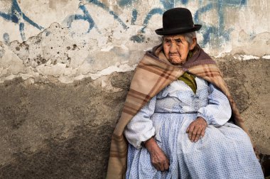 LA PAZ, BOLIVIA - AUGUST 19, 2017 : Unidentified street woman vendor wearing traditional clothing in the local Rodriguez market in La Paz - Bolivia clipart