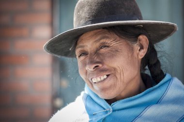 ORURO, BOLIVIA - AUGUST 17, 2017: Bolivian woman along the road to Oruro - Bolivia clipart