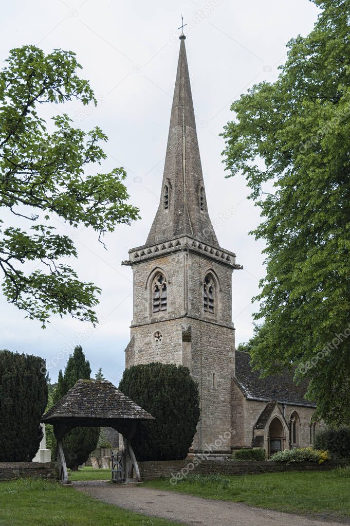 LOWER SLAUGHTER, COTSWOLDS, GLOUCESTERSHIRE, ENGLAND - MAY, 27 2018: Mary's Church with graveyard in the village of Lower Slaughter, Cotswolds, Gloucestershire, England, UK