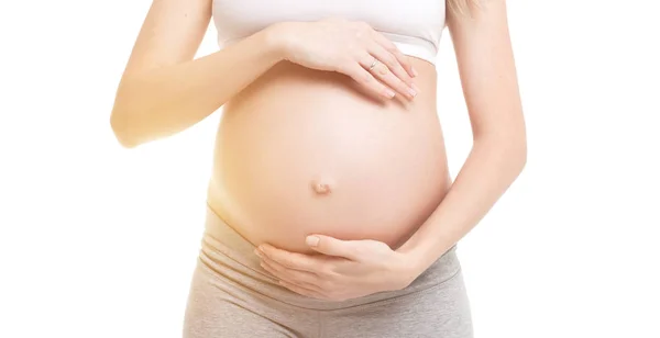 Bliska dotykając jej brzuch kobiety w ciąży — Zdjęcie stockowe