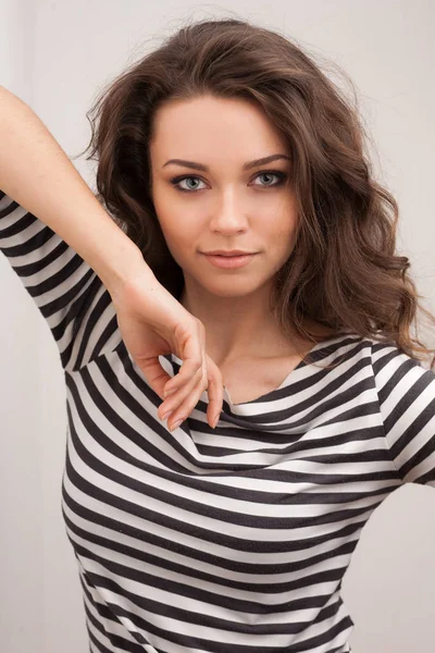 Happy brunette woman with curly hair and perfect smile posing — Stock Photo, Image