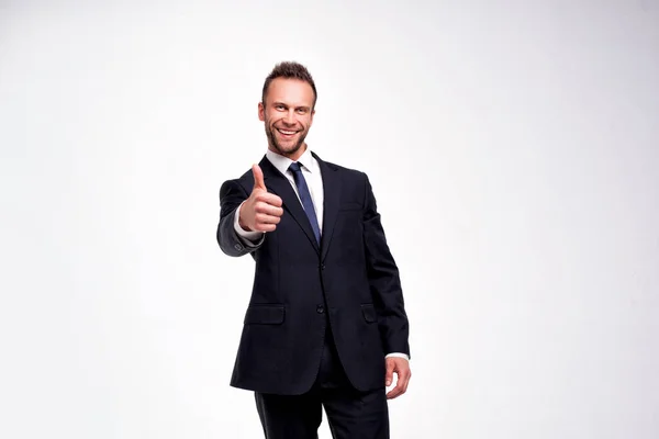 Businessman showing thumbs up gesture — Stock Photo, Image