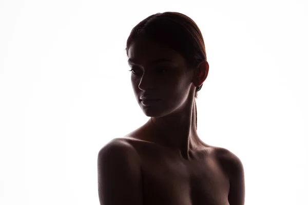 Silhouette of young adult woman with clean fresh skin — Stock Photo, Image