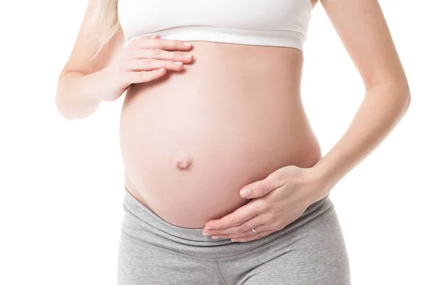 Close-up of pregnant woman touching her belly — Stock Photo, Image