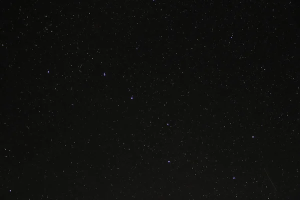 Sky of stars: Big Dipper and traces of meteors