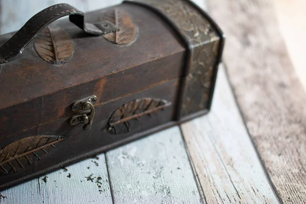 Old chest on a wooden retro background