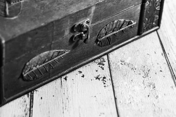 Old chest on a wooden retro background