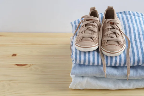 Children Snickers Stack Clothes Jeans Shirt Kid Snickers Wooden Table — Stock Photo, Image