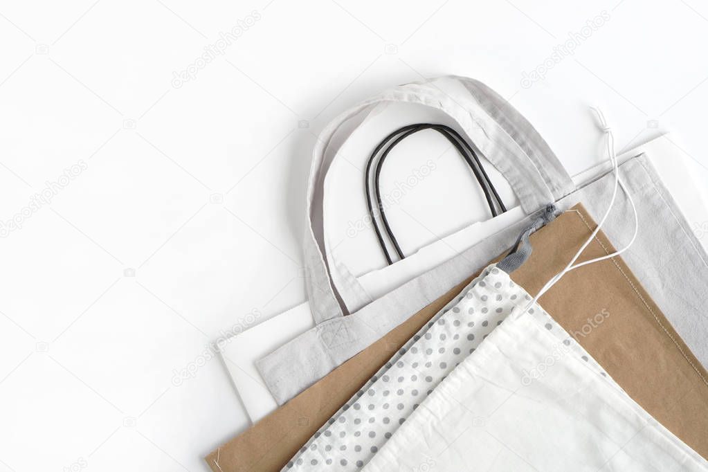 Shopping bags on white background.Cotton and paper bags for free plastic shopping.
