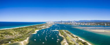 Panoramic sunny view of boats around the Spit and the Gold Coast clipart