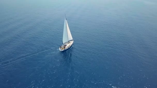 Yacht sailing on opened sea. Sailing boat. Yacht from drone. Yachting video. Yacht from above. Sailboat from drone. Sailing video. Yachting at windy day. Yacht. Sailboat. — Stock Video