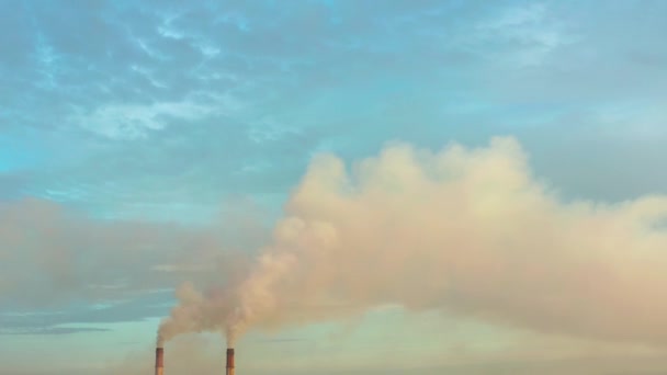 Aerial view. Emission to atmosphere from industrial pipes. Smokestack pipes shooted with drone. Close-up. — Stock Video