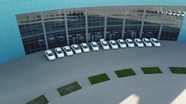 Aerial view over cars in parking — Stock Video