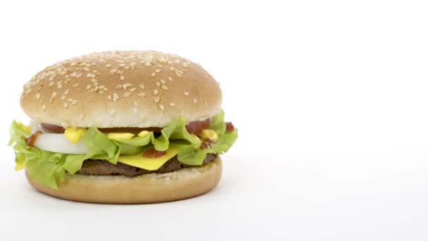 Rotation. Appetizing burger on a white background. — Stock Video
