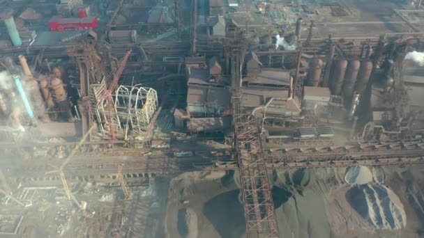 Aerial view over industrialized city with air atmosphere and river water pollution from metallurgical plant near sea. Dirty smoke and smog from pipes of steel factory and blast furnaces. — Stock Video