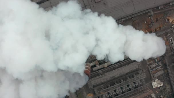 Industrial zone with a large pipe thick white smoke is poured from the factory pipe. Pollution of the environment: a pipe with smoke. Aerial view — Stock Video