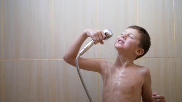 Portrait of cute handsome little kid singing and cheerfully dancing in bathroom. — Stock Video