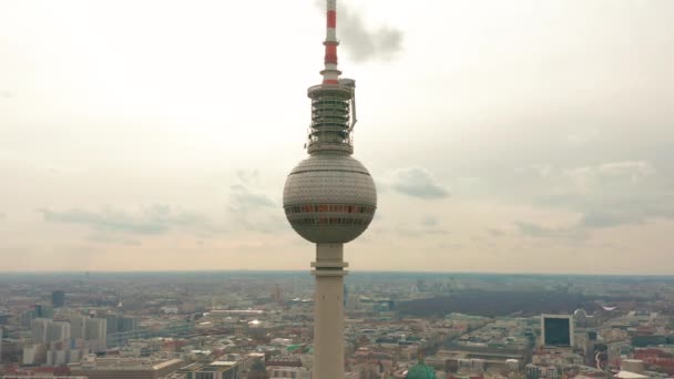 Berlin TV Tower super closeup during a cloudy day, aerial view — Stock Video