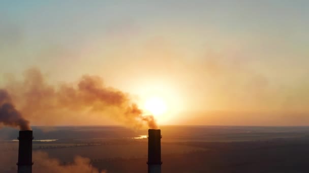 Aerial view. Emission to atmosphere from industrial pipes. Smoking chimney. — Stock Video