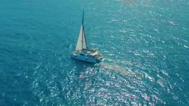 Aerial view. Large sailing catamaran in the open sea. — Stock Video