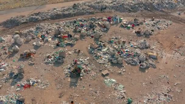 Aerial View. City Dump concept. Environmental pollution. Plastic bottles, bags, trash. Nature polluted from activities of irresponsible people. — Stock Video