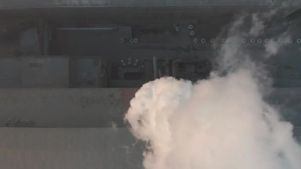 Arial view. Air pollution by smoke coming out of the factory chimneys in the industrial zone. — Stock Video