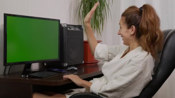 Young woman videoconferencing distance chatting by web cam and laughing using computer virtual chat app on laptop screen. Social distancing communication. — Stock Video