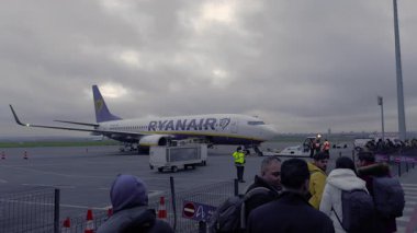 Paris, France, 01.05.2025: The plane is getting ready for takeoff. Passengers are boarding the plane.