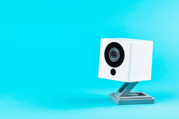 white webcam on blue background, object, Internet, technology concept.