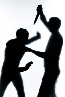 Self-defense battle silhouette. A man fights against an aggressor with a knife. Fight for life against terrorists. clipart