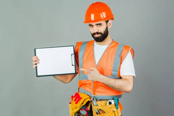 Builder Orange Helmet Gray Background Signs Something — Stock Photo, Image