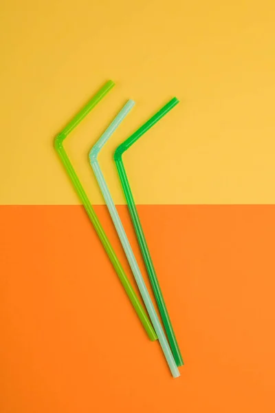 Drinking straws for colored background. Colorful plastic straws used for drinking water or soft drinks