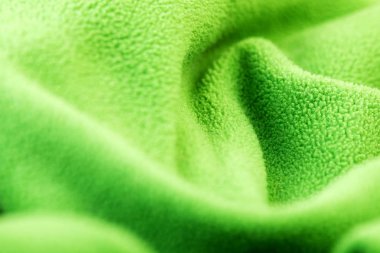 yeşil polar kumaş dokusu. dokunmatik kumaş yumuşak, cilde hoş.